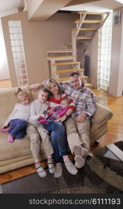 hapy young family have fun with their children at modern living room home indoors