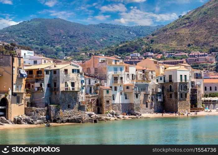 Harbor and old houses in Cefalu in Sicily, Italy in a beautiful summer day