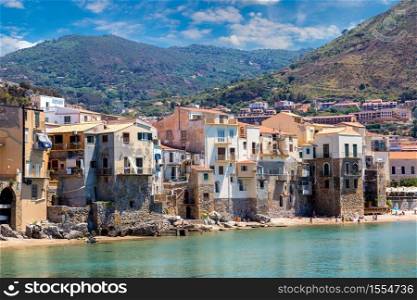 Harbor and old houses in Cefalu in Sicily, Italy in a beautiful summer day