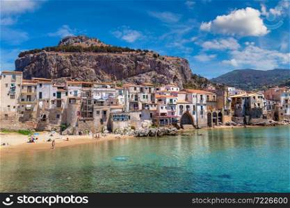 Harbor and old houses in Cefalu in Sicily, Italy in a beautiful summer day