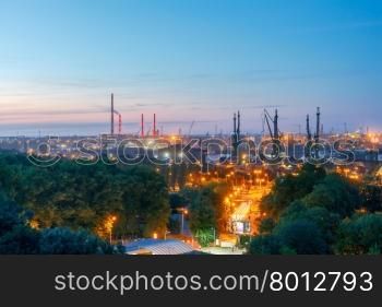 Harbor cranes Gdansk Shipyard in night light.. Gdansk shipyard at night.