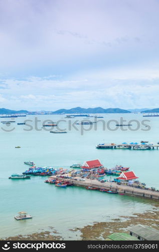 Harbor freight and travel to the island. And there is moored barges.