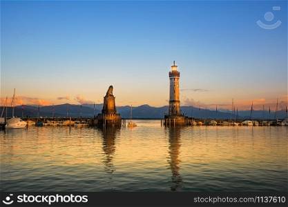 Harbour entrance of Lindau with lighthouse and sculpture of lion. Harbour entrance of Lindau