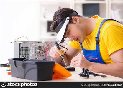 Hard drive repair and data recovery specialist working in lab