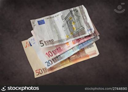 Hard earned money: wrinkled euro bills