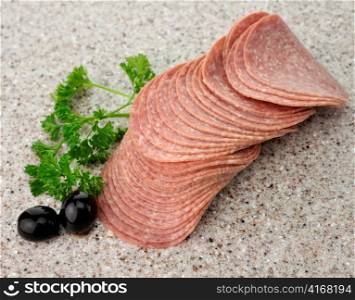 Hard Sliced Salami On A Kitchen Table
