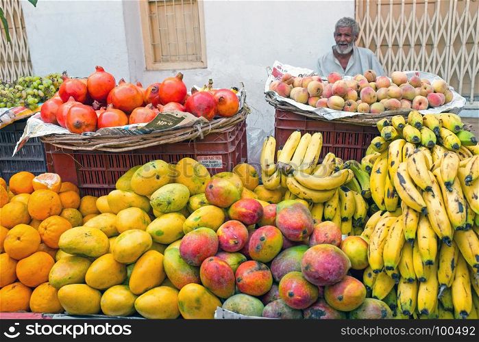 HARDWAR, INDIA - APRIL 24, 2017: Salesman selling fruits on the market in Hardwar,India on 24th of april 2017