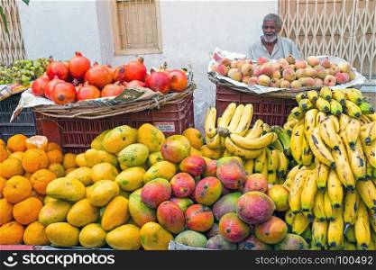 HARDWAR, INDIA - APRIL 24, 2017: Salesman selling fruits on the market in Hardwar,India on 24th of april 2017