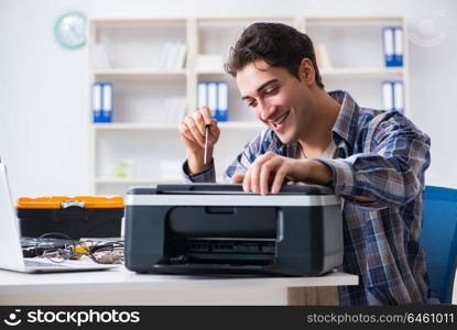 Hardware repairman repairing broken printer fax machine