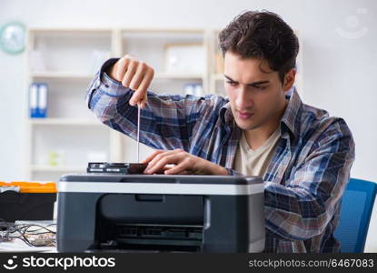 Hardware repairman repairing broken printer fax machine