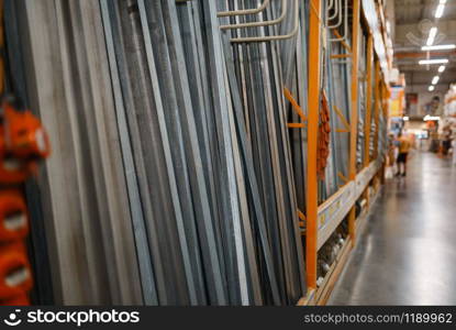 Hardware store assortment on the shelf, nobody. Building materials choice in diy shop, rows of products on racks