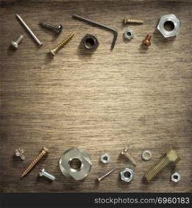 hardware tools and screws at wood. hardware tools and screws at wooden background