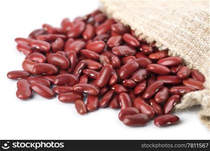 haricot beans falling out of sack isolated