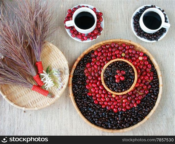 Harmony creative for decor from coffee bean, cup of black cafe, ripe berries, basket of roasted cafe bean, white flower, set up on sackcloth backgroud make amazing conceptual