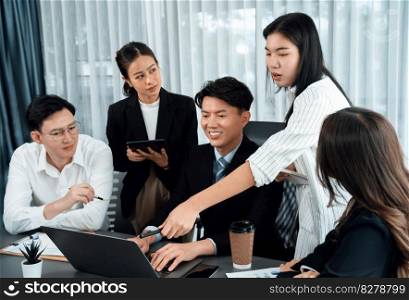 Harmony in office concept as business people analyzing dashboard paper together in workplace. Young colleagues give ideas at manager desk for discussion or strategy planning about project.. Office worker and manager analyze financial report paper in harmony workplace.
