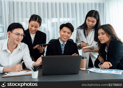 Harmony in office concept as business people analyzing dashboard paper together in workplace. Young colleagues give ideas at manager desk for discussion or strategy planning about project.. Office worker and manager analyze financial report paper in harmony workplace.