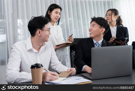 Harmony in office concept as business people analyzing dashboard paper together in workplace. Young colleagues give ideas at manager desk for discussion or strategy planning about project.. Office worker and manager analyze financial report paper in harmony workplace.