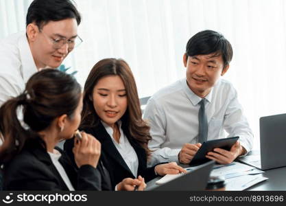 Harmony in office concept as business people analyzing dashboard paper together in workplace. Young colleagues give ideas at manager desk for discussion or strategy planning about project.. Office worker and manager analyze financial report paper in harmony workplace.