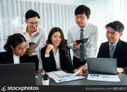 Harmony in office concept as business people analyzing dashboard paper together in workplace. Young colleagues give ideas at manager desk for discussion or strategy planning about project.. Office worker and manager analyze financial report paper in harmony workplace.