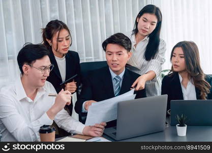 Harmony in office concept as business people analyzing dashboard paper together in workplace. Young colleagues give ideas at manager desk for discussion or strategy planning about project.. Office worker and manager analyze financial report paper in harmony workplace.