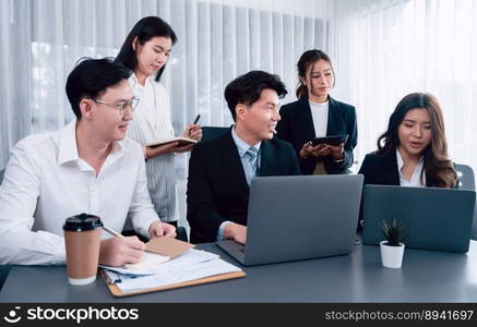 Harmony in office concept as business people analyzing dashboard paper together in workplace. Young colleagues give ideas at manager desk for discussion or strategy planning about project.. Office worker and manager analyze financial report paper in harmony workplace.