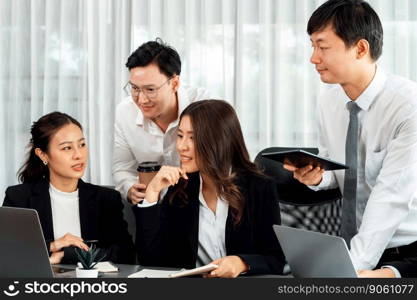 Harmony in office concept as business people analyzing dashboard paper together in workplace. Young colleagues give ideas at manager desk for discussion or strategy planning about project.. Office worker and manager analyze financial report paper in harmony workplace.