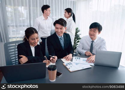 Harmony in office concept as business people analyzing dashboard paper together in workplace. Young colleagues give ideas at manager desk for discussion or strategy planning about project.. Office worker and manager analyze financial report paper in harmony workplace.