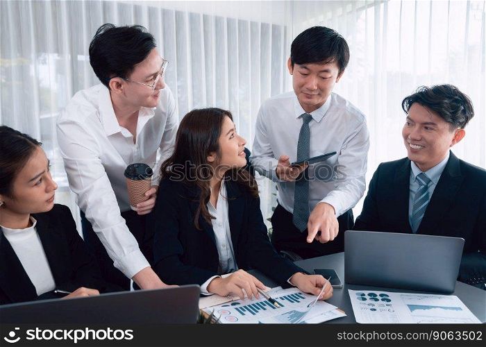 Harmony in office concept as business people analyzing dashboard paper together in workplace. Young colleagues give ideas at manager desk for discussion or strategy planning about project.. Office worker and manager analyze financial report paper in harmony workplace.