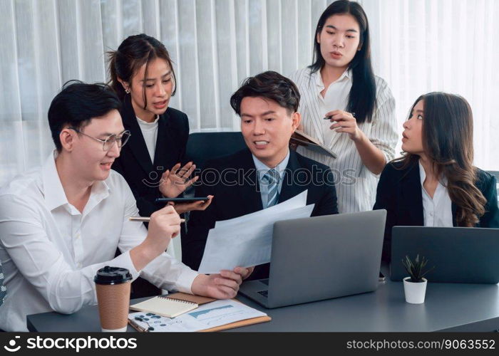 Harmony in office concept as business people analyzing dashboard paper together in workplace. Young colleagues give ideas at manager desk for discussion or strategy planning about project.. Office worker and manager analyze financial report paper in harmony workplace.