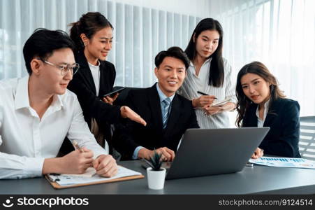 Harmony in office concept as business people analyzing dashboard paper together in workplace. Young colleagues give ideas at manager desk for discussion or strategy planning about project.. Office worker and manager analyze financial report paper in harmony workplace.