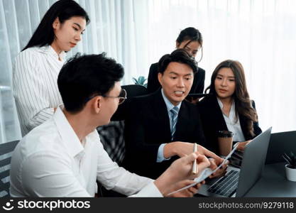 Harmony in office concept as business people analyzing dashboard paper together in workplace. Young colleagues give ideas at manager desk for discussion or strategy planning about project.. Office worker and manager analyze financial report paper in harmony workplace.