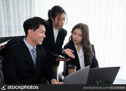 Harmony in office concept as business people analyzing dashboard paper together in workplace. Young colleagues give ideas at manager desk for discussion or strategy planning about project.. Office worker and manager analyze financial report paper in harmony workplace.