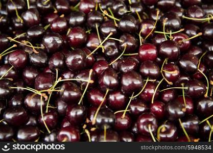 harvest, food, fruits and agriculture concept - close up of cherries
