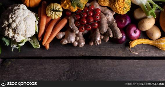 Harvest of many various colorful vegetables on wooden background. Harvest vegetables background