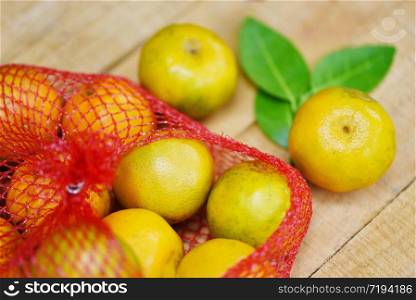 Harvest orange and orange leaf healthy fruits concept / Fresh orange fruit on wooden background