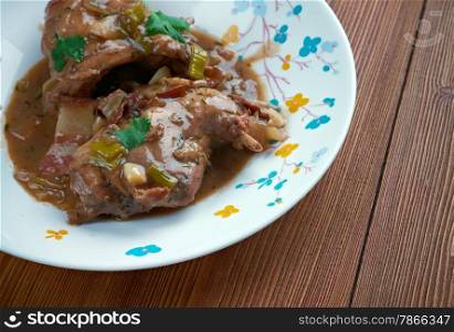 Hasenpfeffer - traditional German stew made from marinated made from wine rabbit with onions.