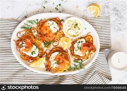 Hash brown potato with smoked salmon, dill white sauce. Potato Pancakes. delicious Vegetable fritters. Potato patties or hash browns. Crispy hashed browned potatoes