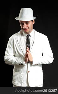 Hat suit joyful young man. Wearing white suit and black tie. Portrait of handsome funny man. One from collection.
