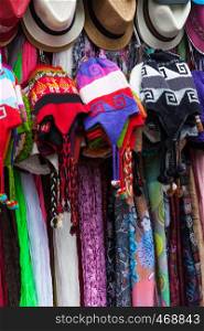 hats and scarves in a market in Peru