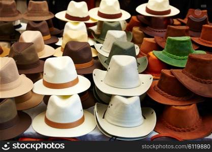 Hats in outdoor store stacked in a row