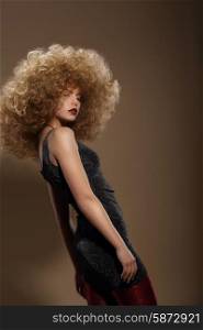 Haute Couture. Fashion Woman with Fancy Hairstyle