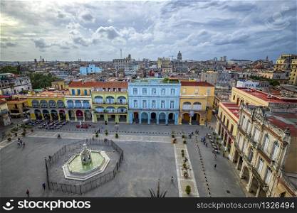 Havana, Cuba - December 20, 2018: Old Town Square, Plaza Vieja with colorful buildings, Havana, Cuba