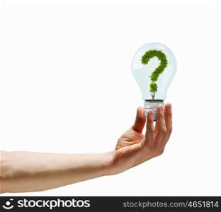 Have question. Human hand holding bulb with question mark inside