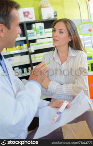 having a conversation with the pharmacist