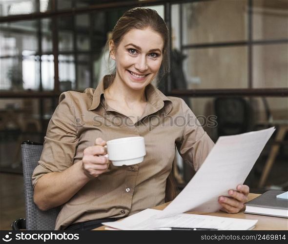having coffee reading papers