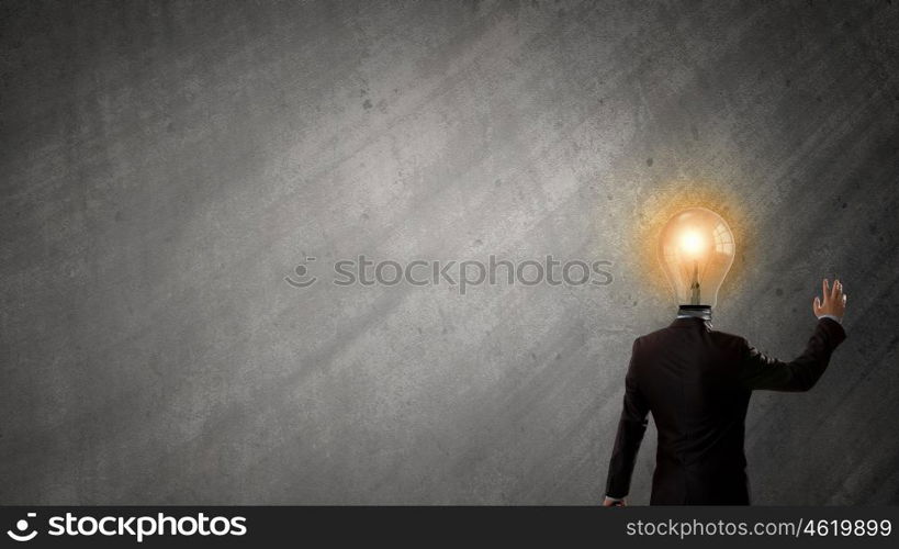 Having great idea in head. Idea concept with businessman and light bulb instead of his head