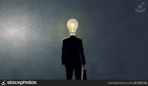 Having great idea in head. Idea concept with businessman and light bulb instead of his head