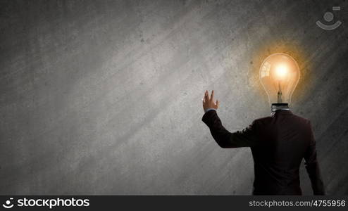 Having great idea in head. Idea concept with businessman and light bulb instead of his head