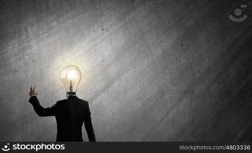 Having great idea in head. Idea concept with businessman and light bulb instead of his head