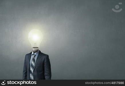 Having great idea in head. Idea concept with businessman and light bulb instead of his head